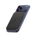 Black Anker Nano MagGo 5K power bank attached to the back of an iPhone.