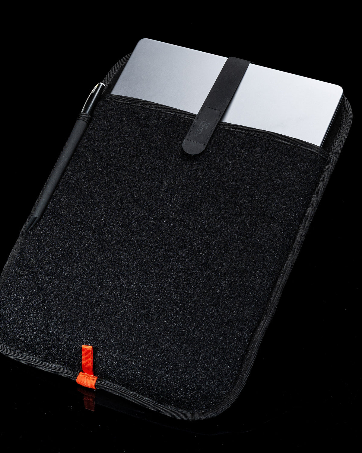 The Brown Buffalo laptop sleeve shown in a lifestyle product photograph.