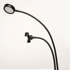 Close-up of the live streaming kit LED light and phone holder on two flexible black arms.