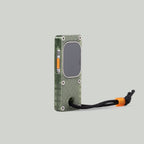 Angled view of the olive green miniPhone Ultra case showing the Apple Watch Ultra orange action button.