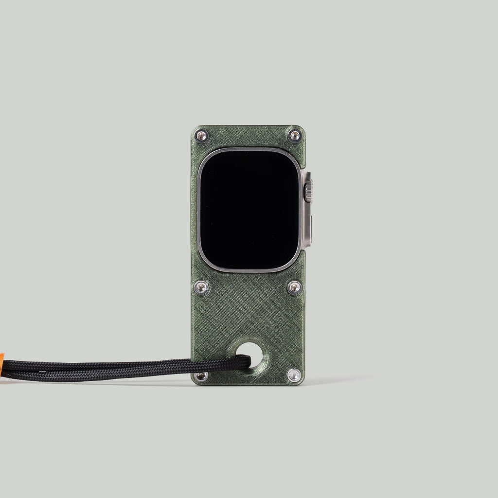 Front view of an olive green miniPhone Ultra case holding an Apple Watch Ultra with its screen off.